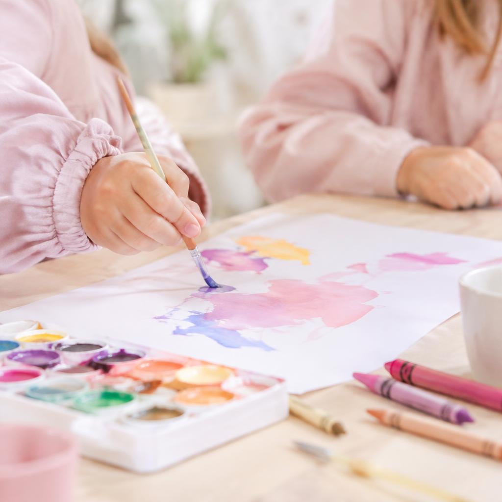 Children painting with watercolors (illustrative photo)